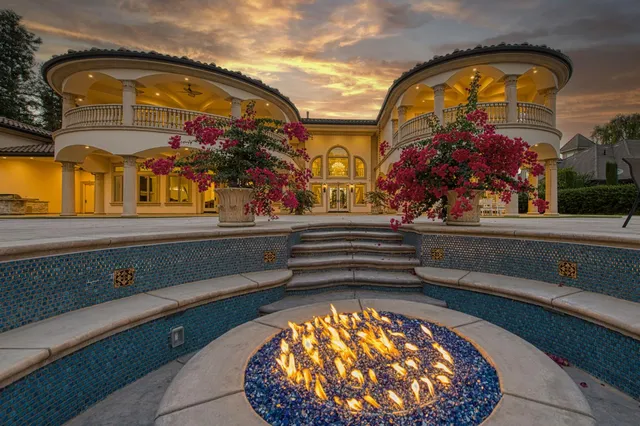 an aerial view of a house with a swimming pool