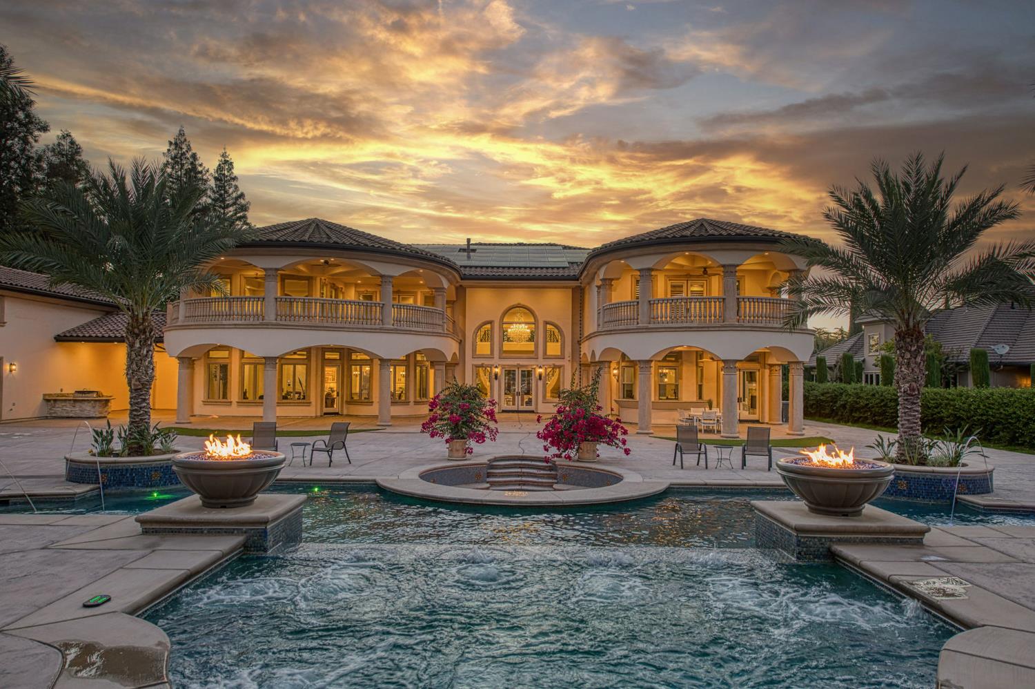 6060 North Van Ness Boulevard Fresno, CA 93711 - Photo 23 of 26 a front view of a house with a yard fire pit and outdoor seating