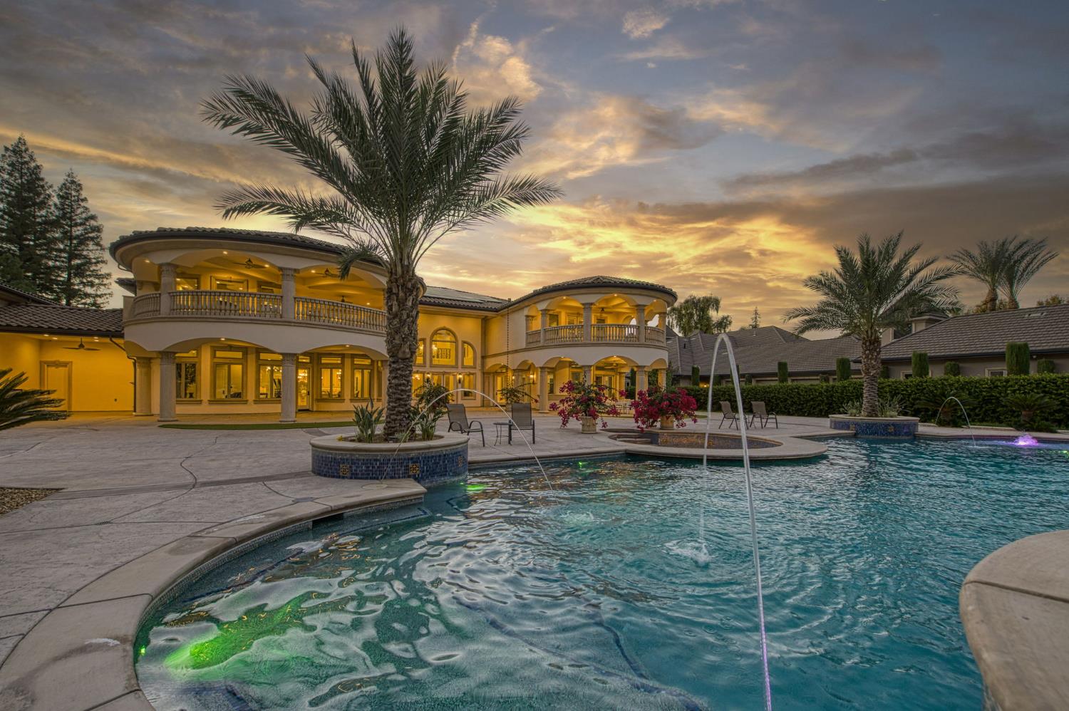 6060 North Van Ness Boulevard Fresno, CA 93711 - Photo 24 of 26 a view of a house with a backyard and a patio
