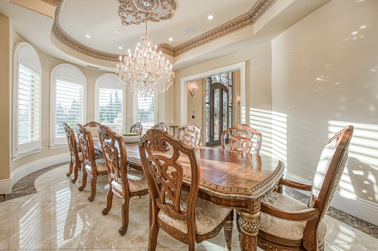 6060 North Van Ness Boulevard Fresno, CA 93711 - Photo 10 of 26 a dining room with furniture a chandelier and wooden floor