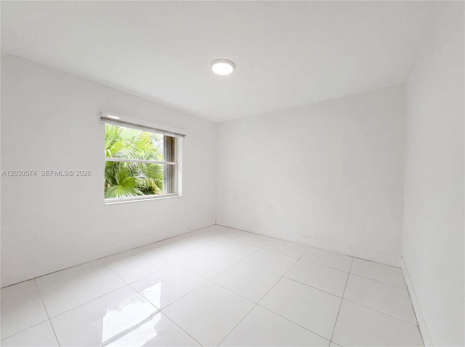 16571 Southwest 145th Avenue Miami, FL 33177 - Photo 17 of 25 an empty room with windows