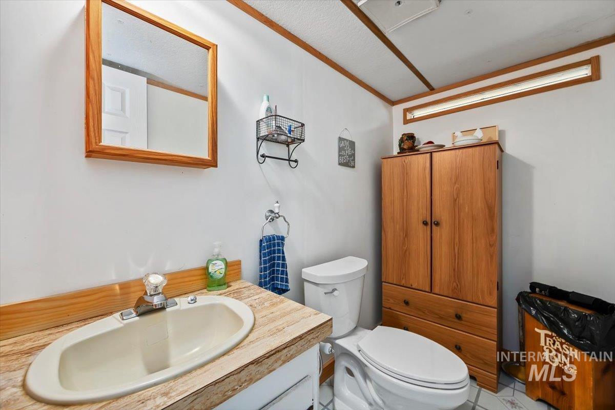102 Willow Creek Road Fairfield, ID 83327 - Photo 17 of 32 Bathroom featuring vanity and toilet