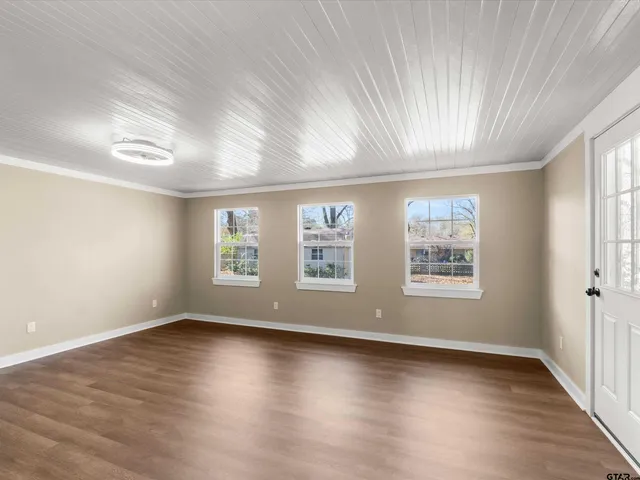 a view of cabinets and wooden floor