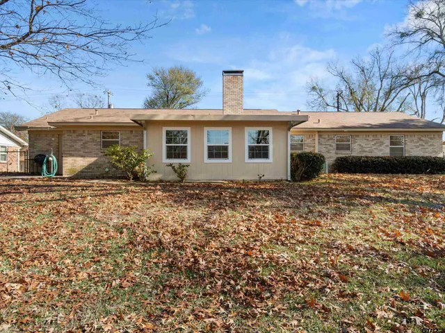 a front view of a house with yard