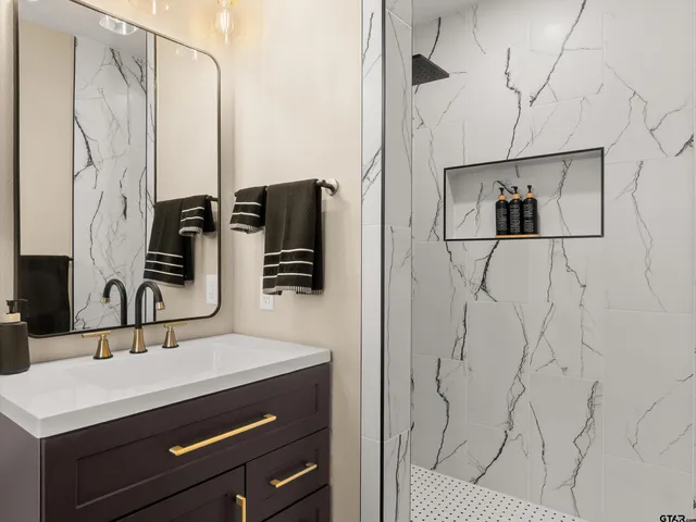 a bathroom with a sink and a mirror