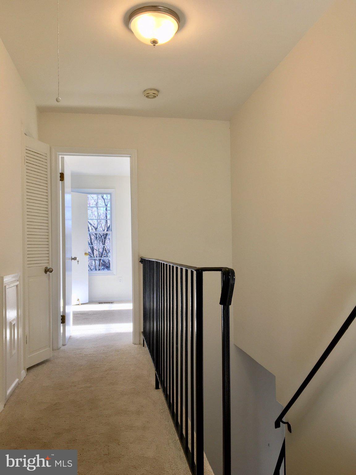 11951 Heathcote Court Reston, VA 20191 - Photo 7 of 14 Bright and inviting upper hallway.