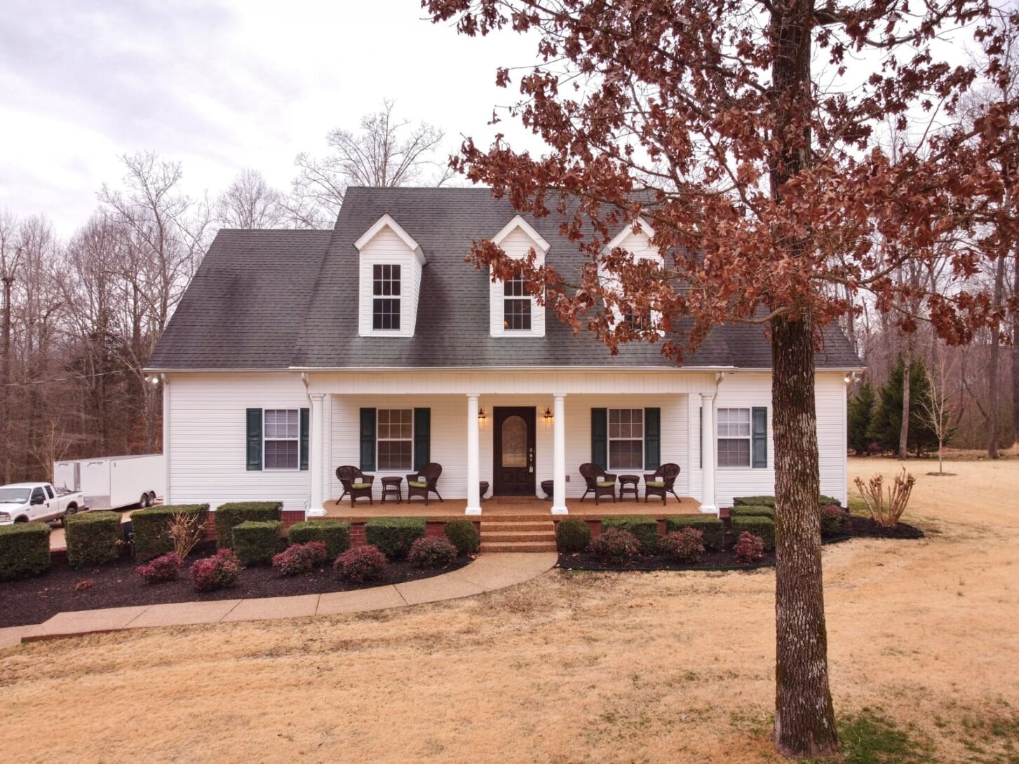 1014 Meeks Cemetery Road Burns, TN 37029 - Photo 1 of 33 a view of a house with a large tree in front of it