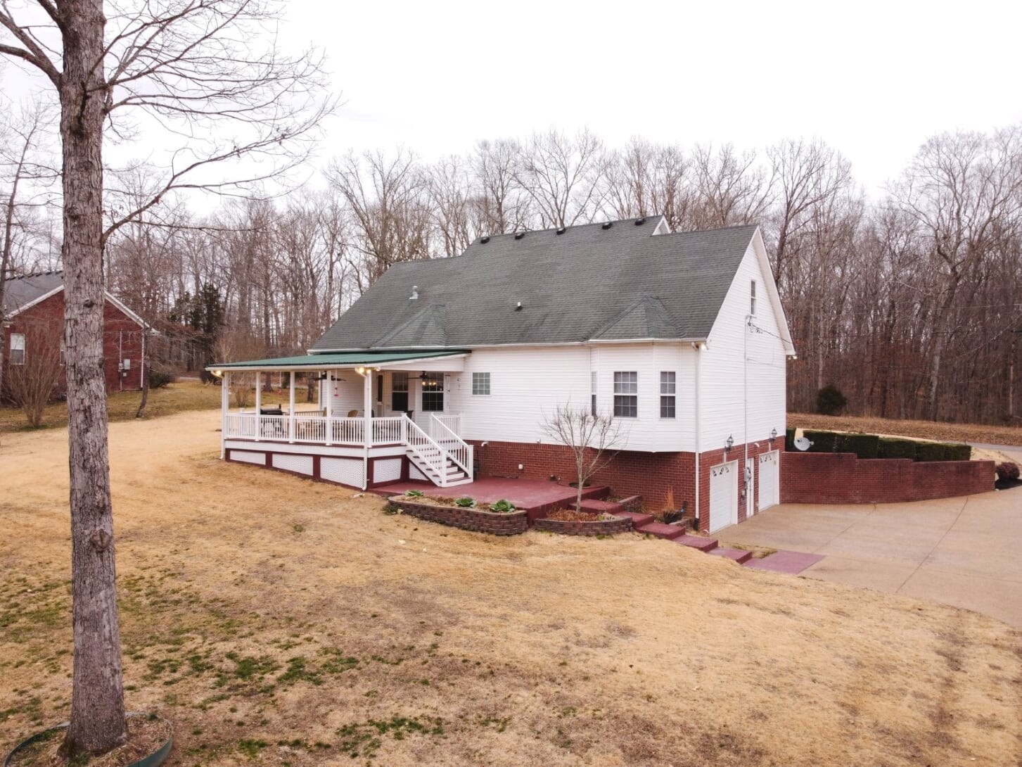 1014 Meeks Cemetery Road Burns, TN 37029 - Photo 29 of 33 a view of a house with a yard covered in snow