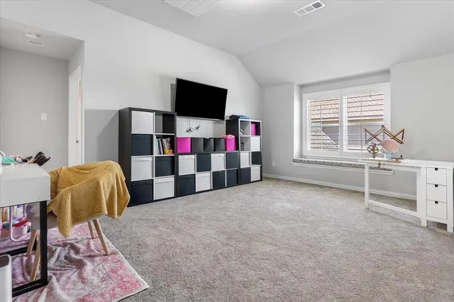 a view of a livingroom with furniture and a window