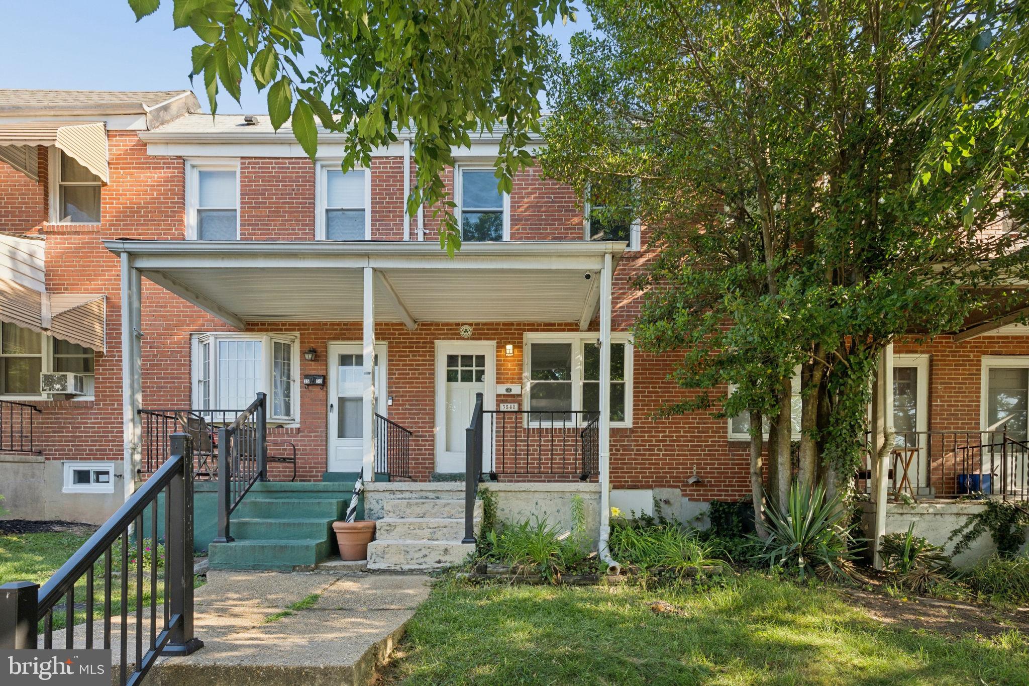 3548 Benzinger Road Baltimore, MD 21229 - Photo 3 of 40 front view of a house with a yard