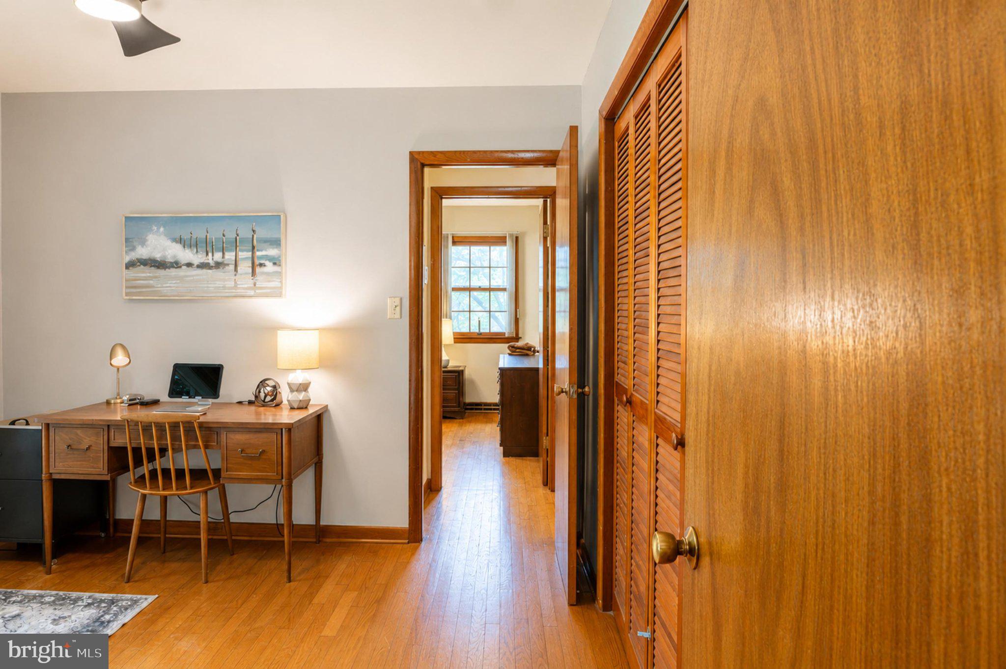 610 Beach Road White Stone, VA 22578 - Photo 9 of 23 Cozy workspace with warm wood tones.