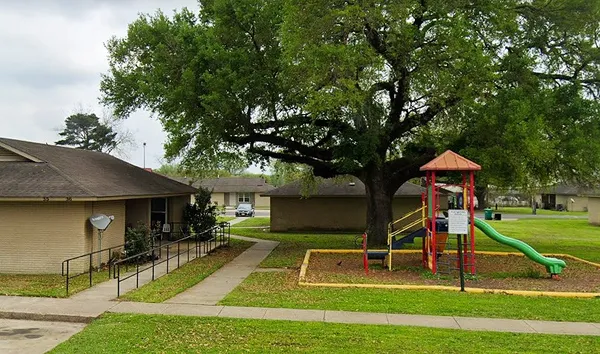 a view of a house with swimming pool and a yard