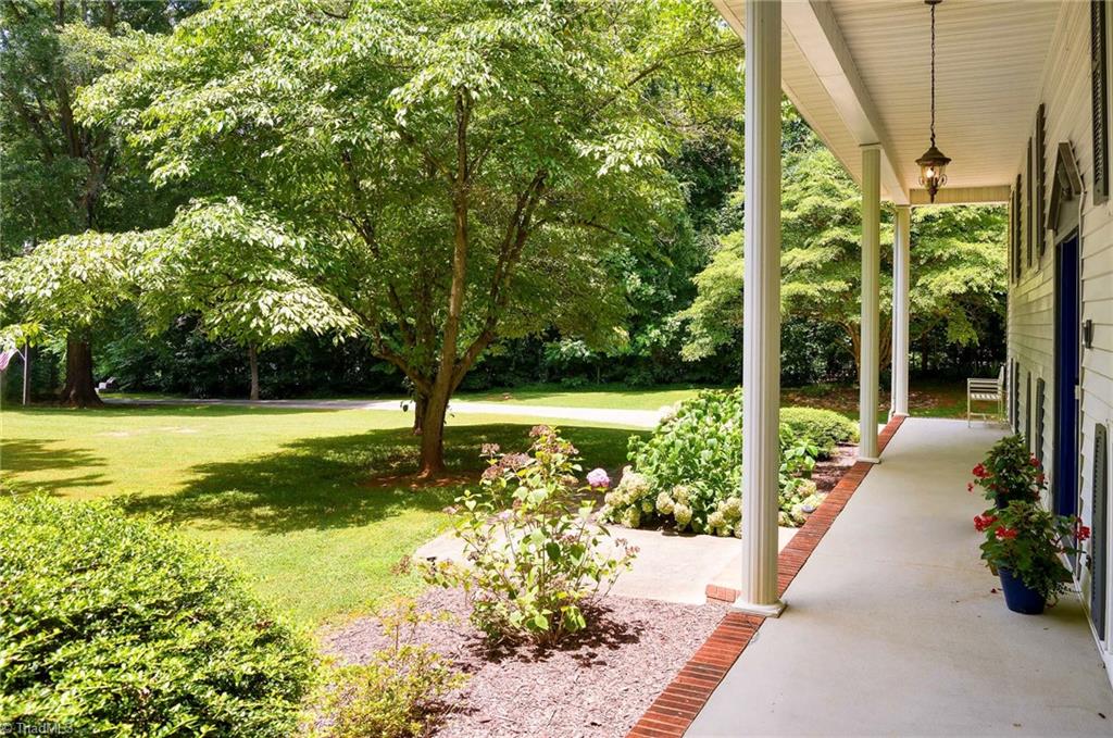 692 Beauchamp Road Advance, NC 27006 - Photo 4 of 40 Beautiful front porch perfect for rocking chairs!