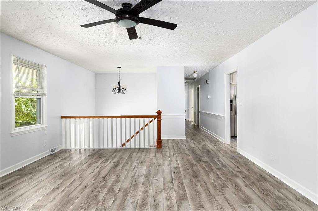 692 Beauchamp Road Advance, NC 27006 - Photo 6 of 40 New LVP flooring throughout the main floor!