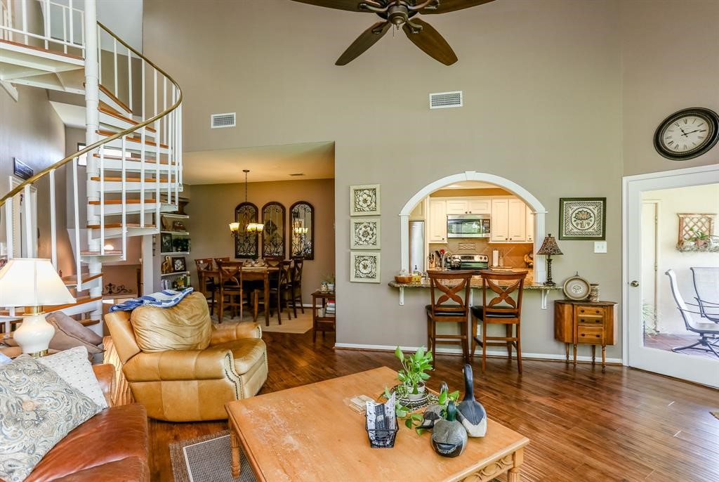 4144 Greystone Way, Unit 306 Sugar Land, TX 77479 - Photo 2 of 11 a living room with furniture and wooden floor