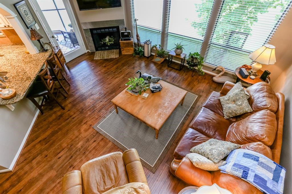 4144 Greystone Way, Unit 306 Sugar Land, TX 77479 - Photo 3 of 11 a living room with furniture and a fireplace
