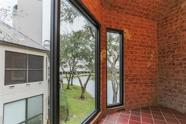 a bathroom with a glass door shower and a sink