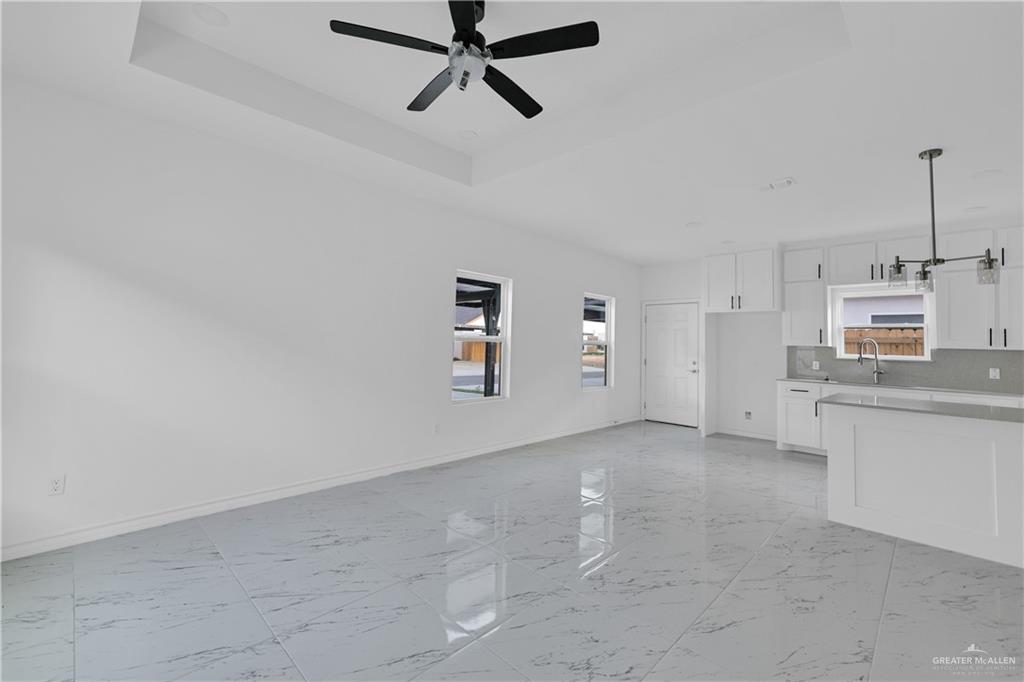 11403 North 25th Street, Unit 2 McAllen, TX 78504 - Photo 3 of 14 a view of a kitchen with microwave and dishwasher