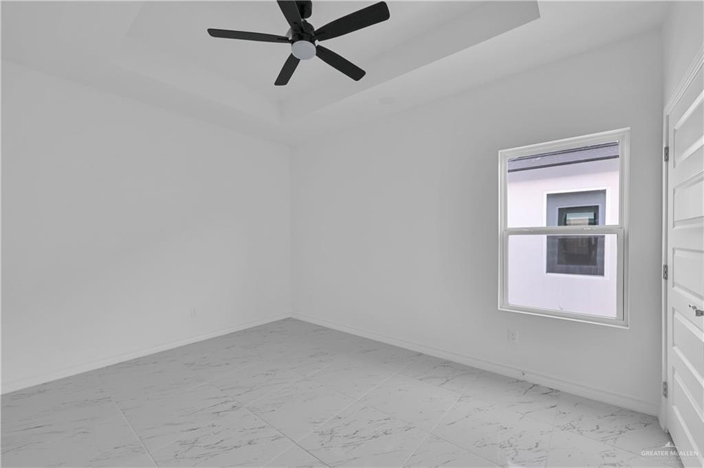 11403 North 25th Street, Unit 2 McAllen, TX 78504 - Photo 9 of 14 an empty room with a window