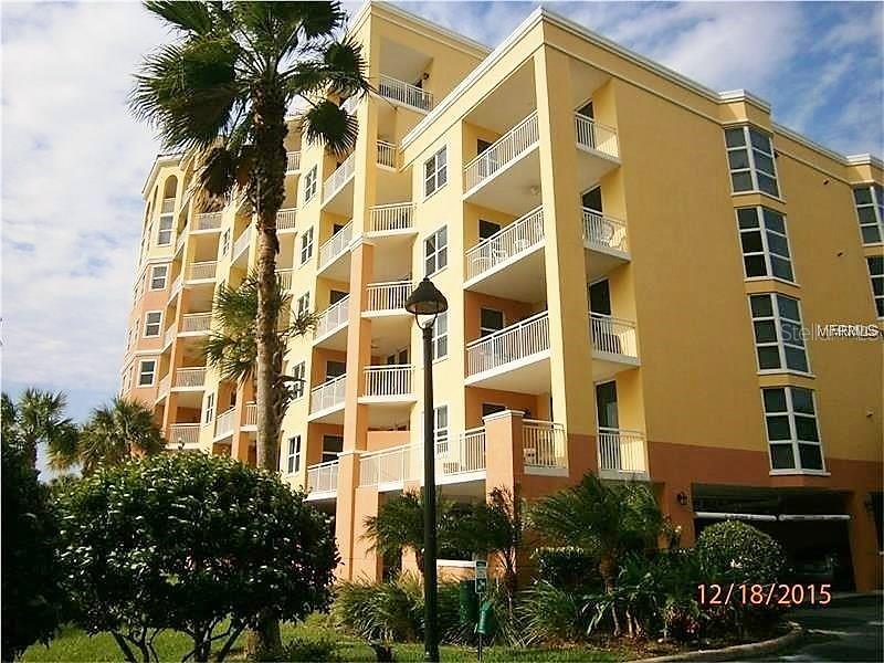 615 Riviera Dunes Way, Unit 406 Palmetto, FL 34221 - Photo 1 of 28 a front view of a multi story building