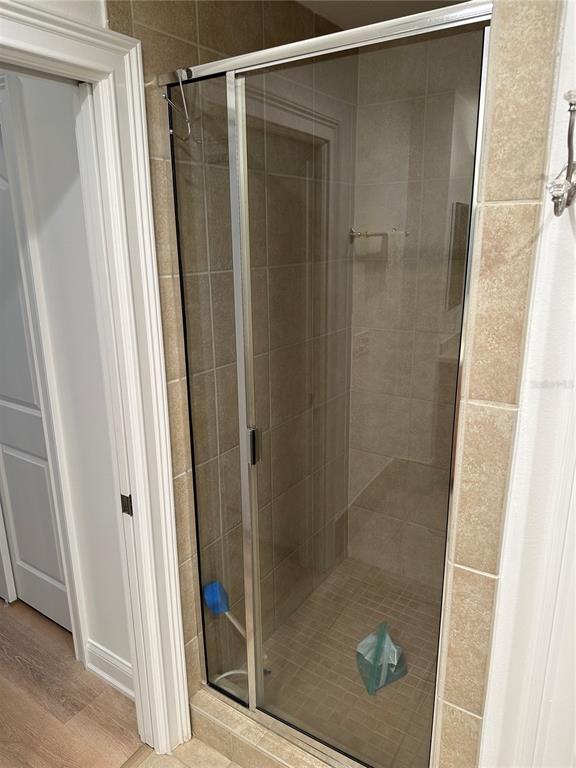 615 Riviera Dunes Way, Unit 406 Palmetto, FL 34221 - Photo 15 of 28 a bathroom with a glass door shower