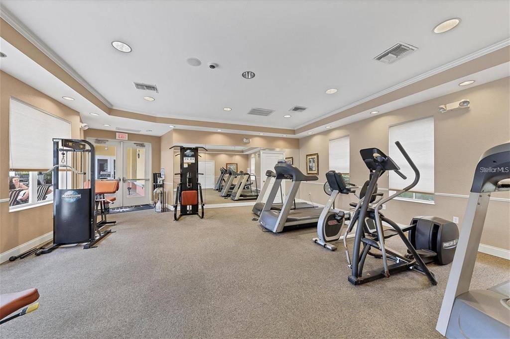 615 Riviera Dunes Way, Unit 406 Palmetto, FL 34221 - Photo 25 of 28 a view of a room with gym equipment