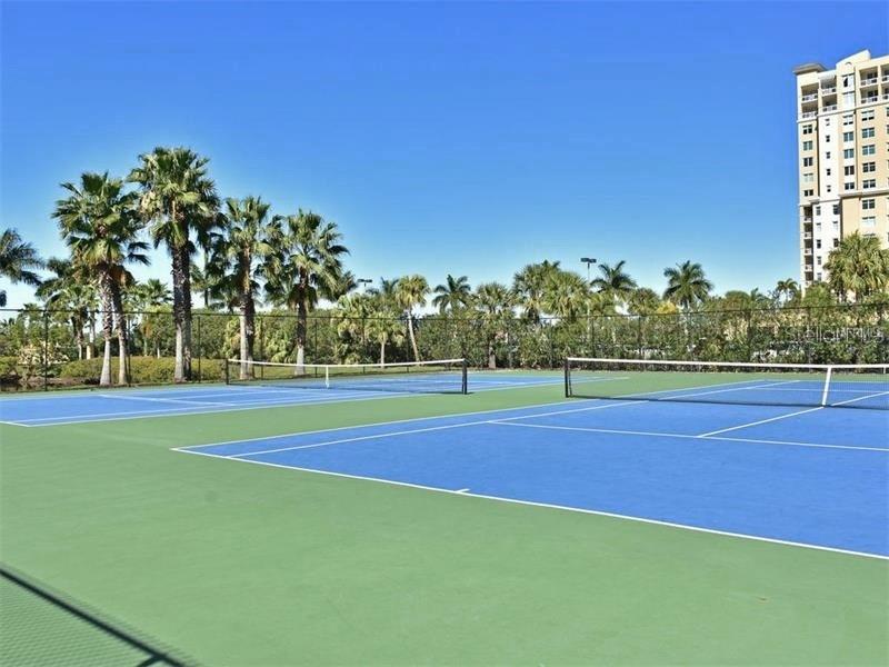 615 Riviera Dunes Way, Unit 406 Palmetto, FL 34221 - Photo 26 of 28 a view of outdoor space and tennis court