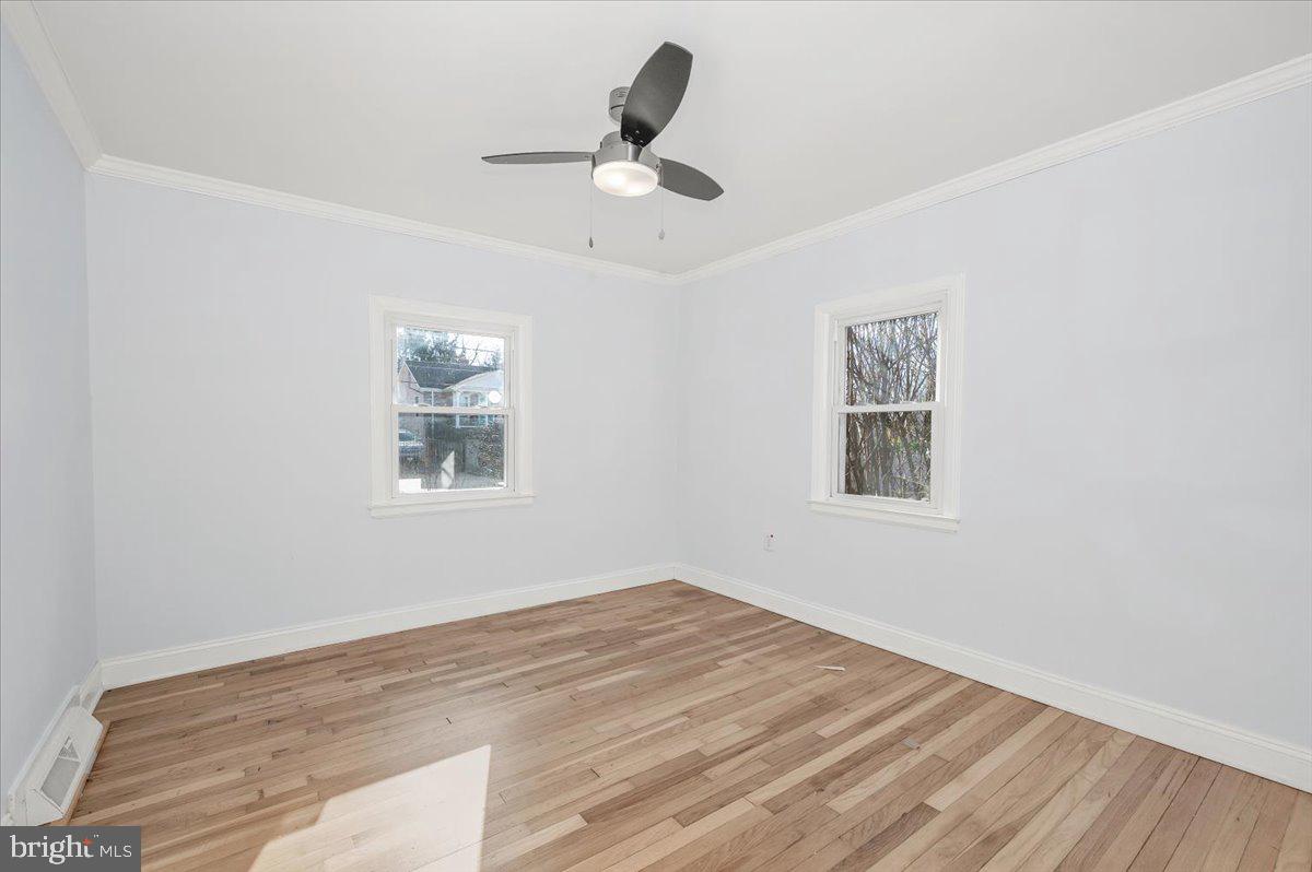 4511 Bennion Road Silver Spring, MD 20906 - Photo 15 of 40 a view of empty room with wooden floor and fan