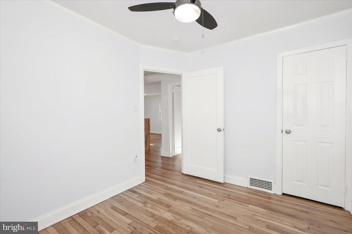 4511 Bennion Road Silver Spring, MD 20906 - Photo 18 of 40 a view of an empty room with wooden floor