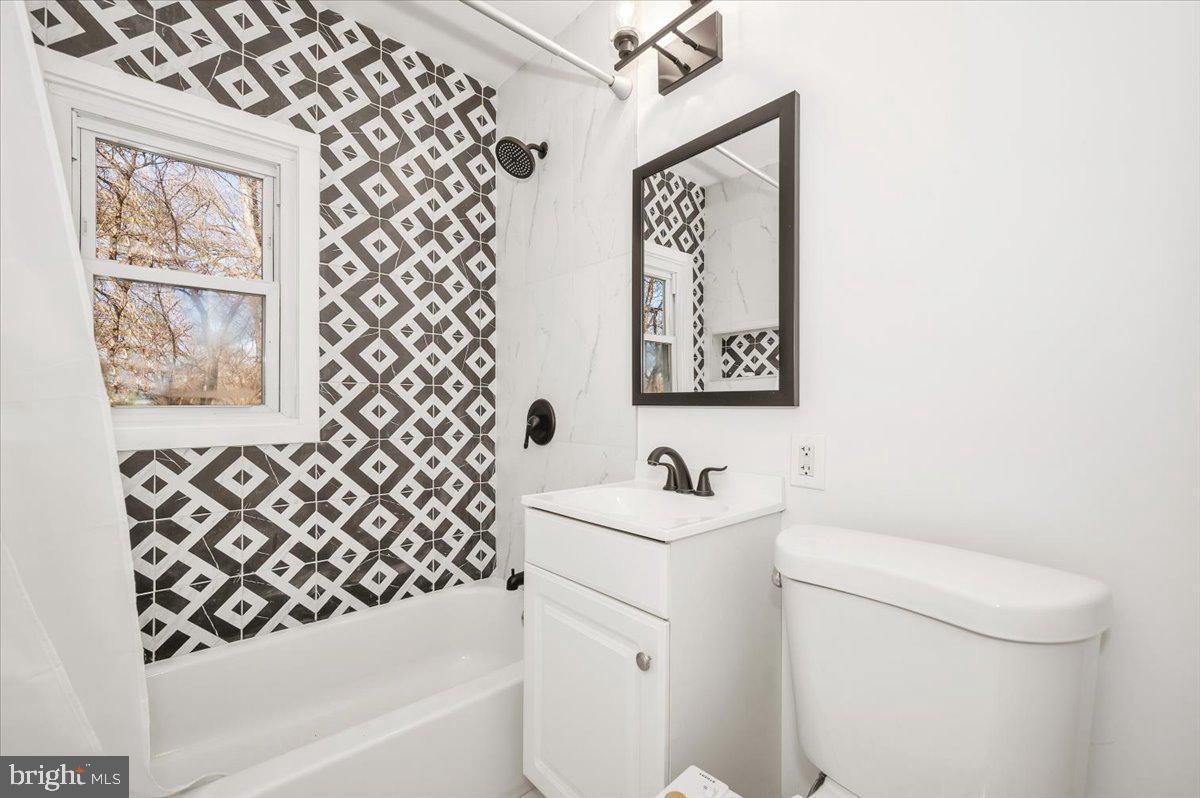 4511 Bennion Road Silver Spring, MD 20906 - Photo 19 of 40 a bathroom with a toilet and a sink