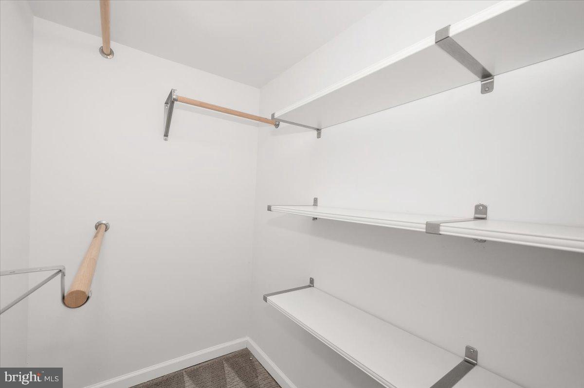 4511 Bennion Road Silver Spring, MD 20906 - Photo 28 of 40 a view of walk in closet with empty racks