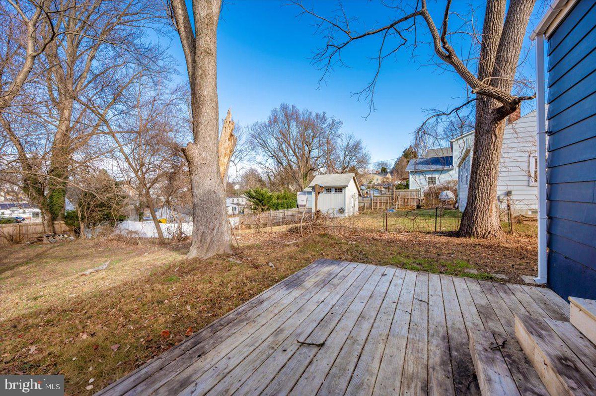 4511 Bennion Road Silver Spring, MD 20906 - Photo 34 of 40 a view of outdoor space with wooden floor and trees