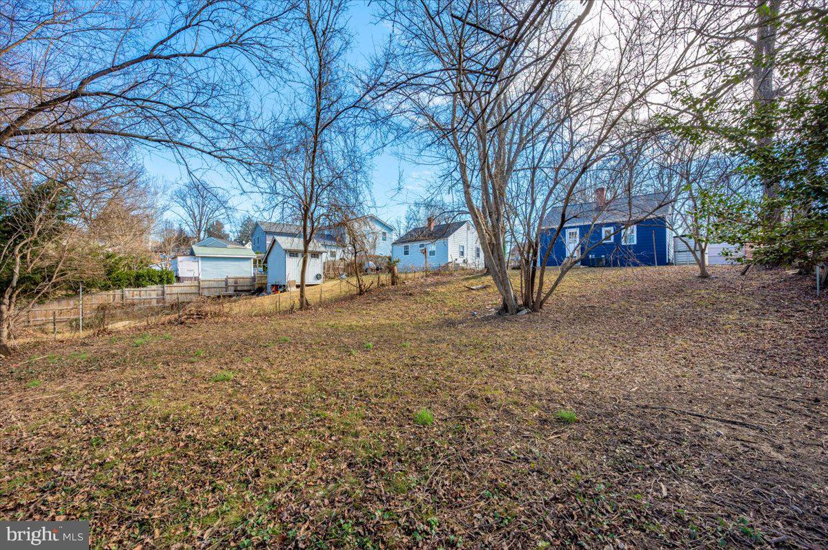 4511 Bennion Road Silver Spring, MD 20906 - Photo 38 of 40 a view of house with yard and trees