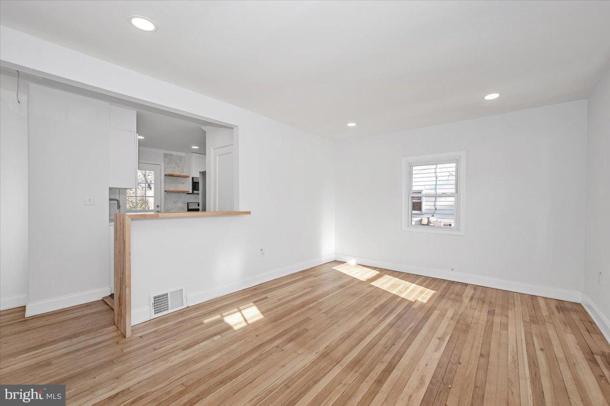 4511 Bennion Road Silver Spring, MD 20906 - Photo 5 of 40 a view of empty room with wooden floor and fan