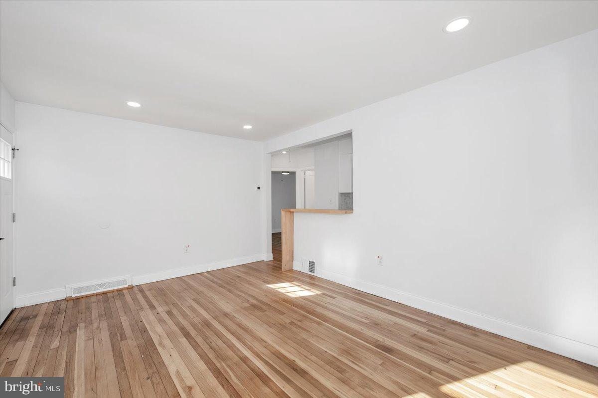 4511 Bennion Road Silver Spring, MD 20906 - Photo 6 of 40 a view of empty room with wooden floor