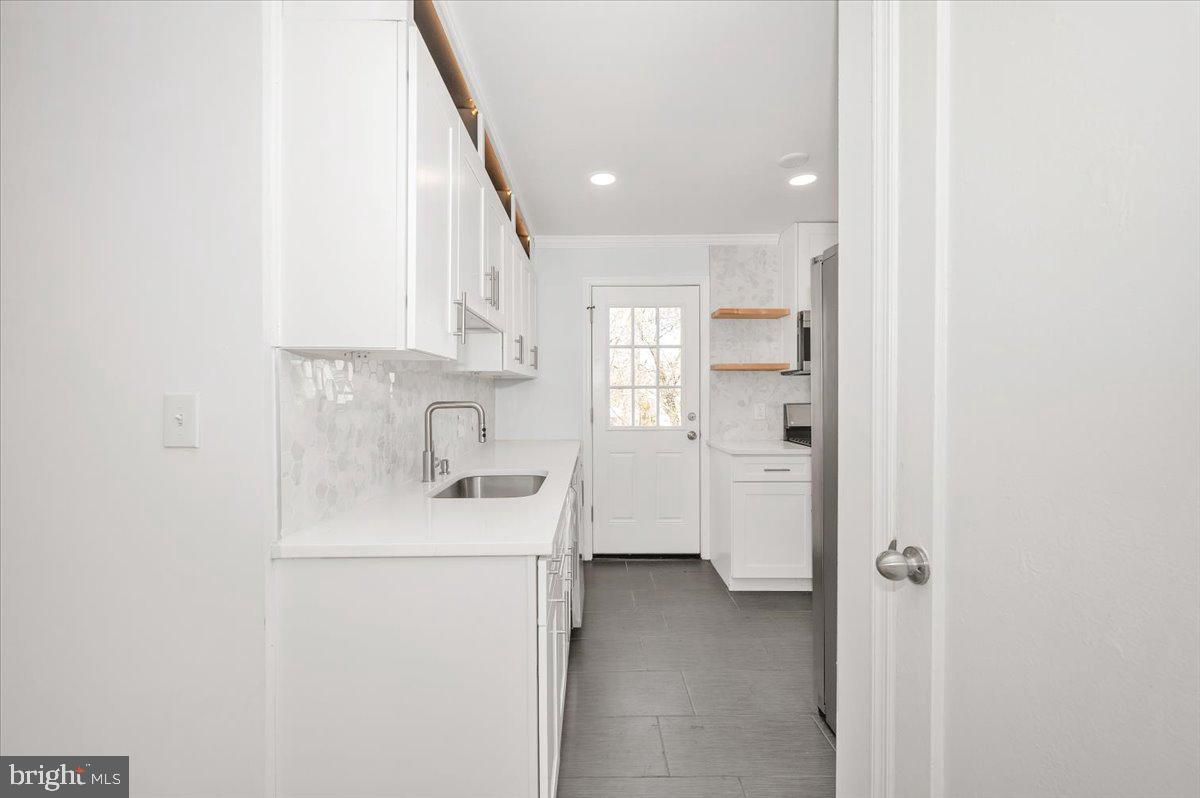 4511 Bennion Road Silver Spring, MD 20906 - Photo 7 of 40 a view of a hallway with washer and dryer