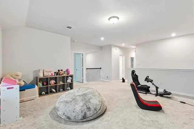 a room with furniture and air hockey table