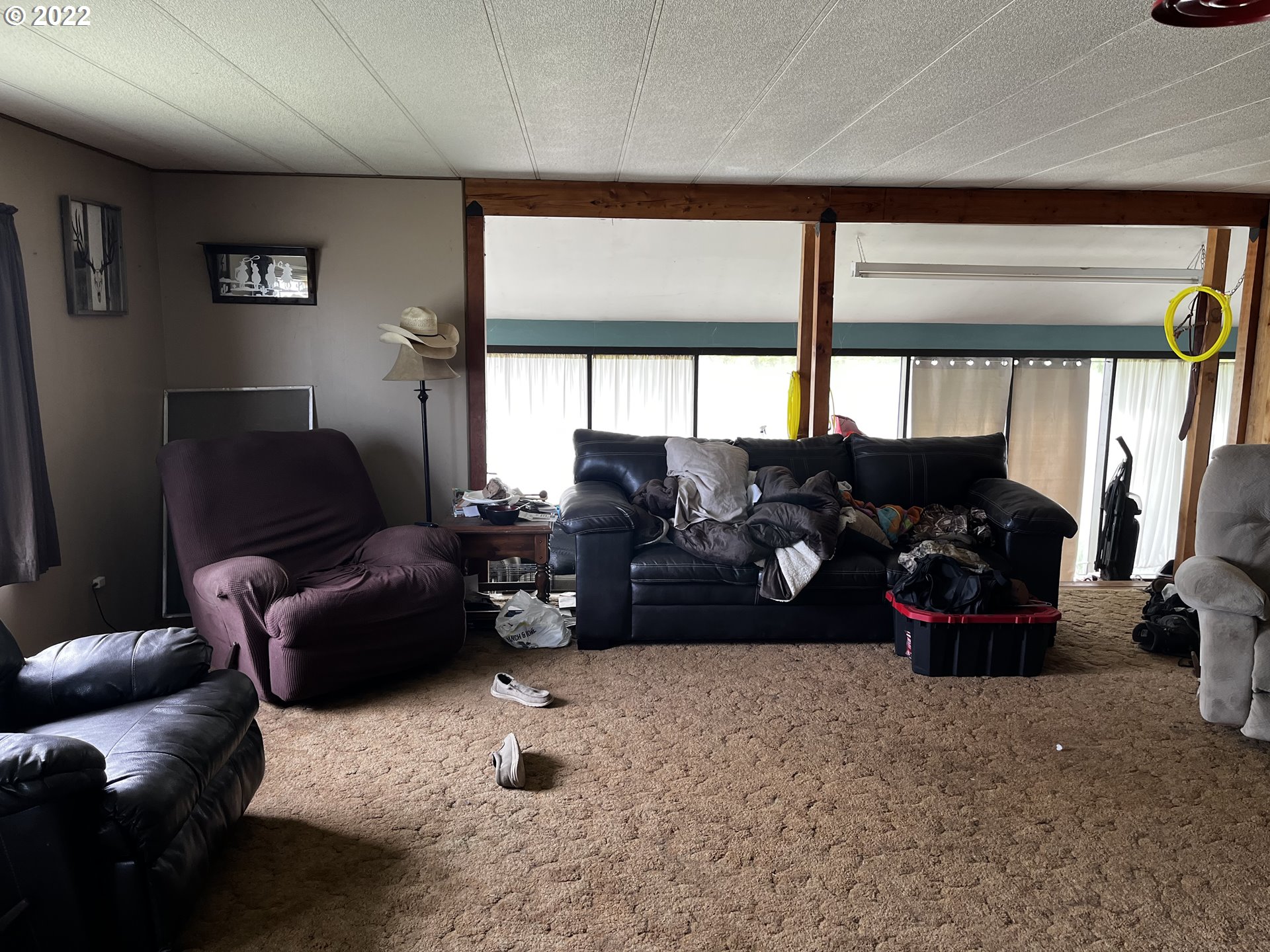 911 East Punkin Center Road Hermiston, OR 97838 - Photo 8 of 12 a living room with furniture and a large window