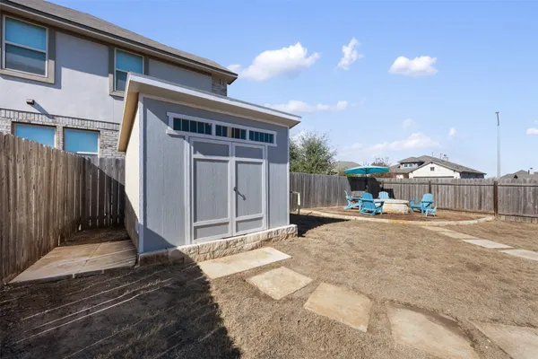 a front view of house with yard and car parked