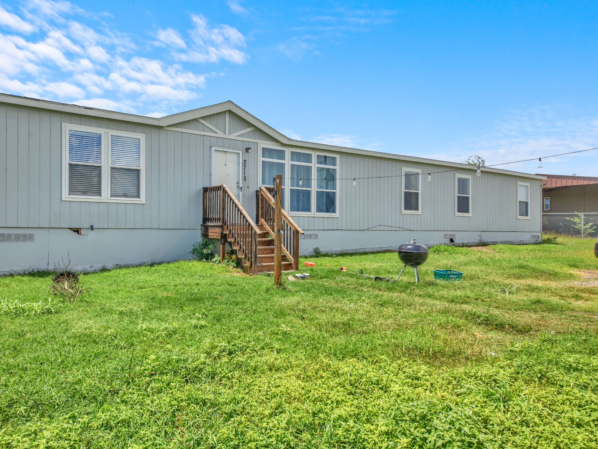 271 Alma Lane Kyle, TX 78640 - Photo 2 of 25 a view of a house with backyard and sitting area