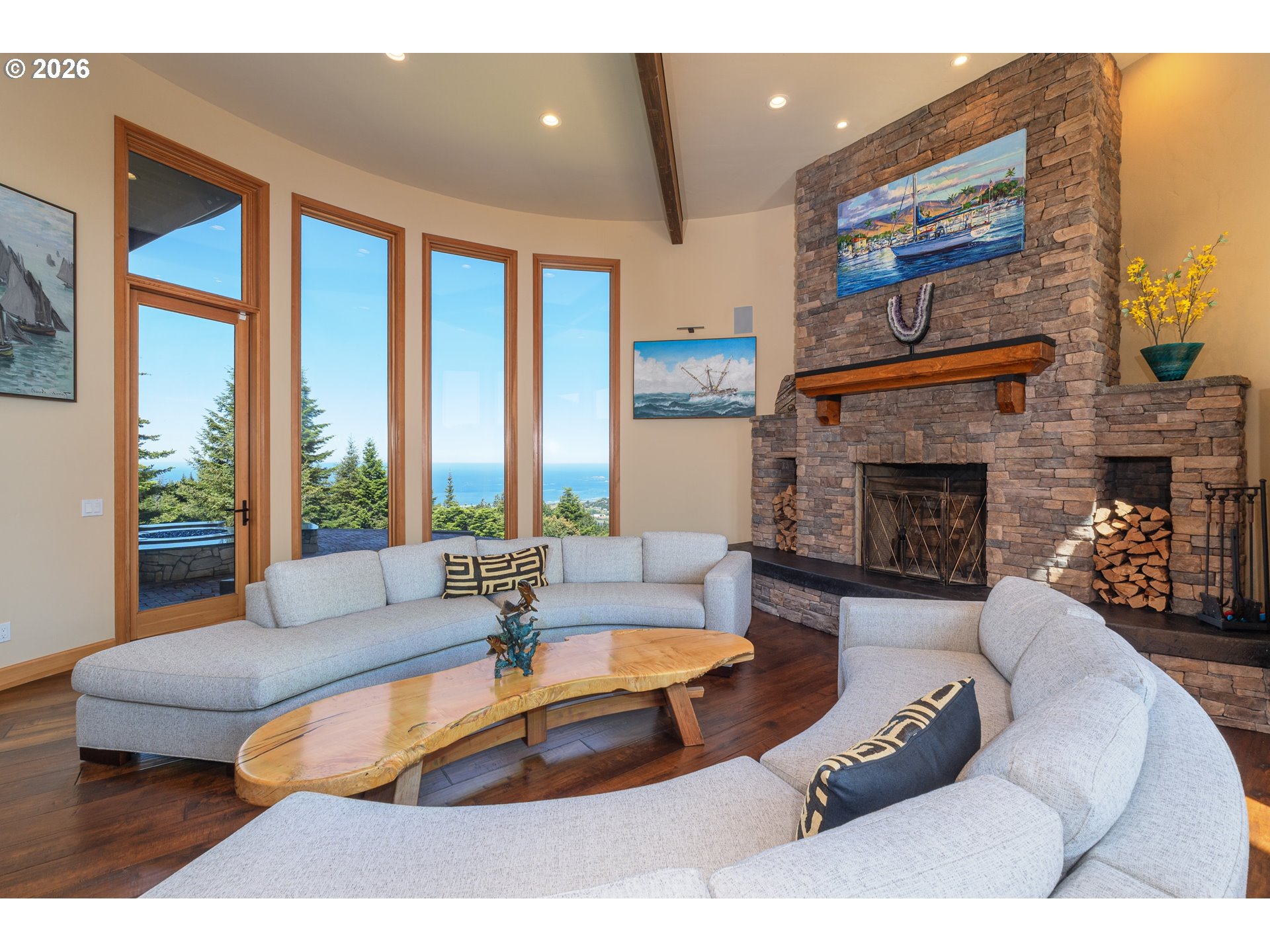 94880 Grizzly Mountain Road Gold Beach, OR 97444 - Photo 7 of 48 a living room with furniture large window and a fireplace