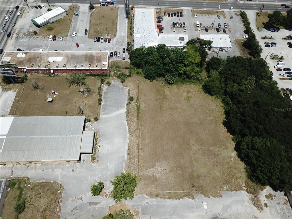 2425 North Hiawassee Road Orlando, FL 32818 - Photo 8 of 10 an aerial view of a house with a yard