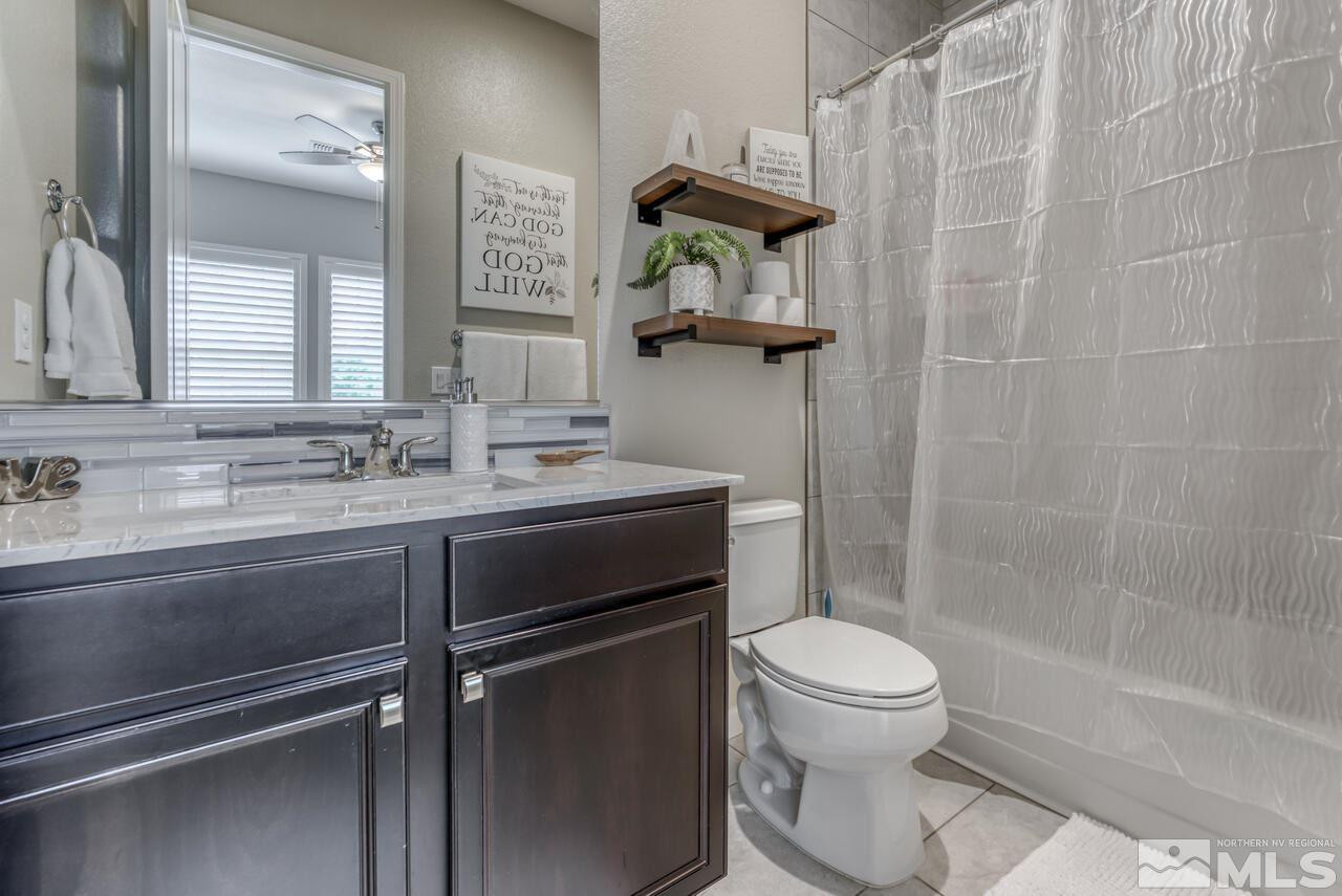 9450 Baldacci Road Reno, NV 89521 - Photo 7 of 40 a bathroom with a sink a toilet and shower