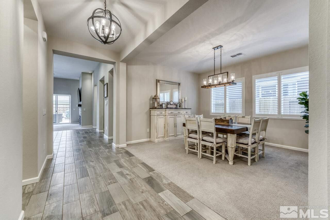 9450 Baldacci Road Reno, NV 89521 - Photo 8 of 40 a view of a dining room with furniture window and wooden floor