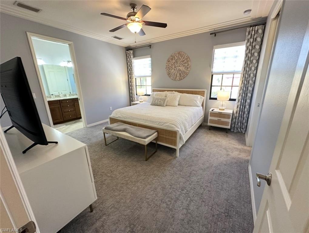 8997 Cambria Circle, Unit 2001 Naples, FL 34113 - Photo 15 of 42 Bedroom featuring light carpet, crown molding, and visible vents
