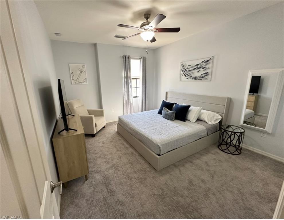 8997 Cambria Circle, Unit 2001 Naples, FL 34113 - Photo 19 of 42 Bedroom featuring baseboards, visible vents, ceiling fan, and carpet flooring