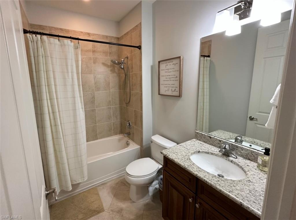 8997 Cambria Circle, Unit 2001 Naples, FL 34113 - Photo 20 of 42 Bathroom featuring toilet, vanity, and shower / bath combo