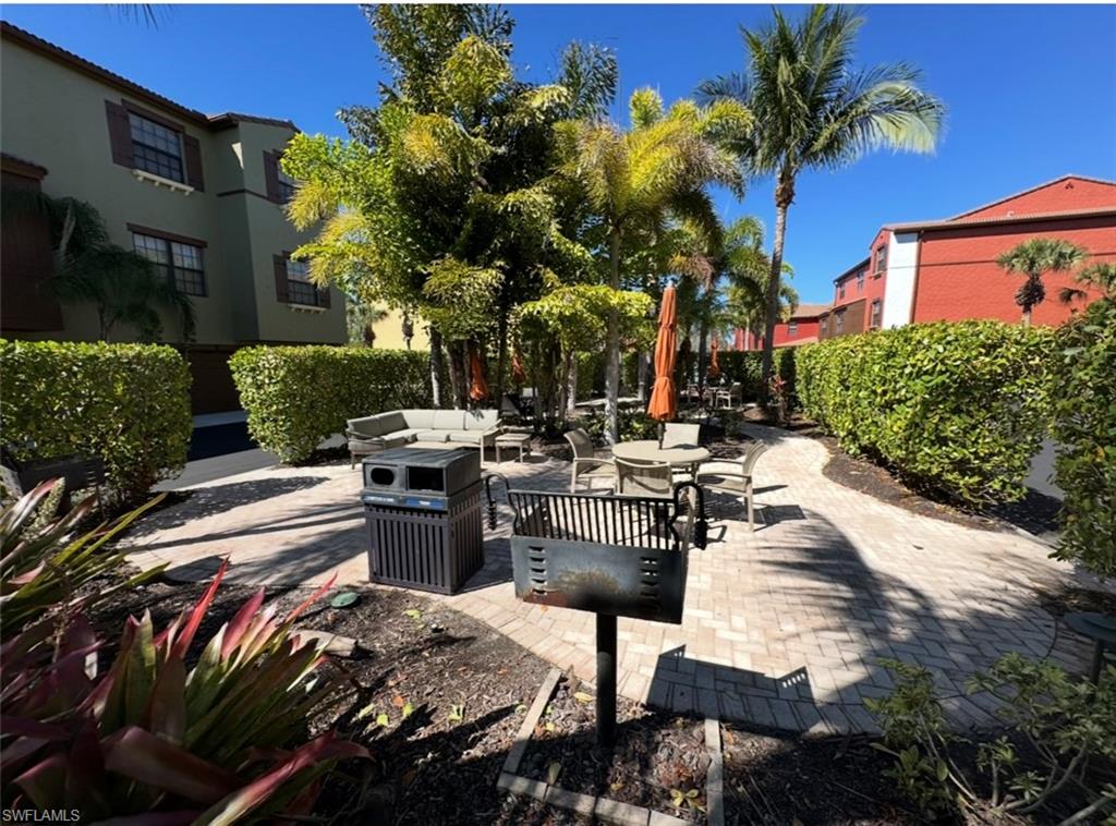 8997 Cambria Circle, Unit 2001 Naples, FL 34113 - Photo 22 of 42 View of patio with an outdoor hangout area
