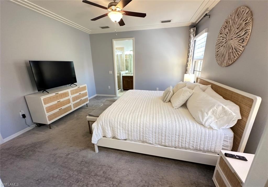 8997 Cambria Circle, Unit 2001 Naples, FL 34113 - Photo 24 of 42 Bedroom with visible vents, crown molding, and carpet