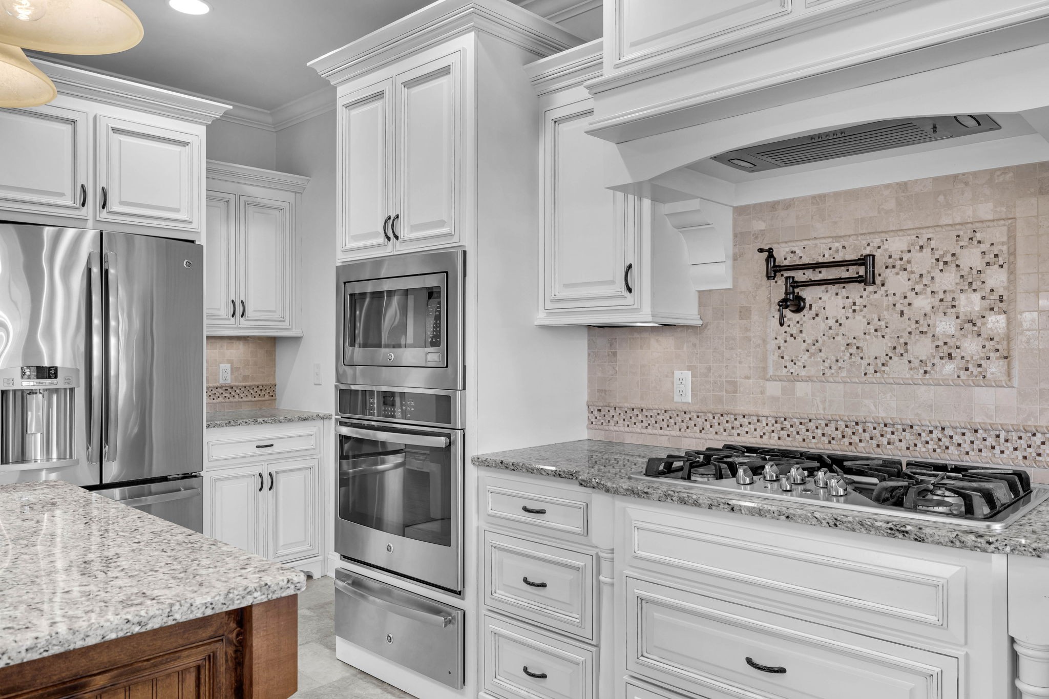 2065 Autumn Ridge Way Spring Hill, TN 37174 - Photo 20 of 58 a kitchen with granite countertop white cabinets and stainless steel appliances